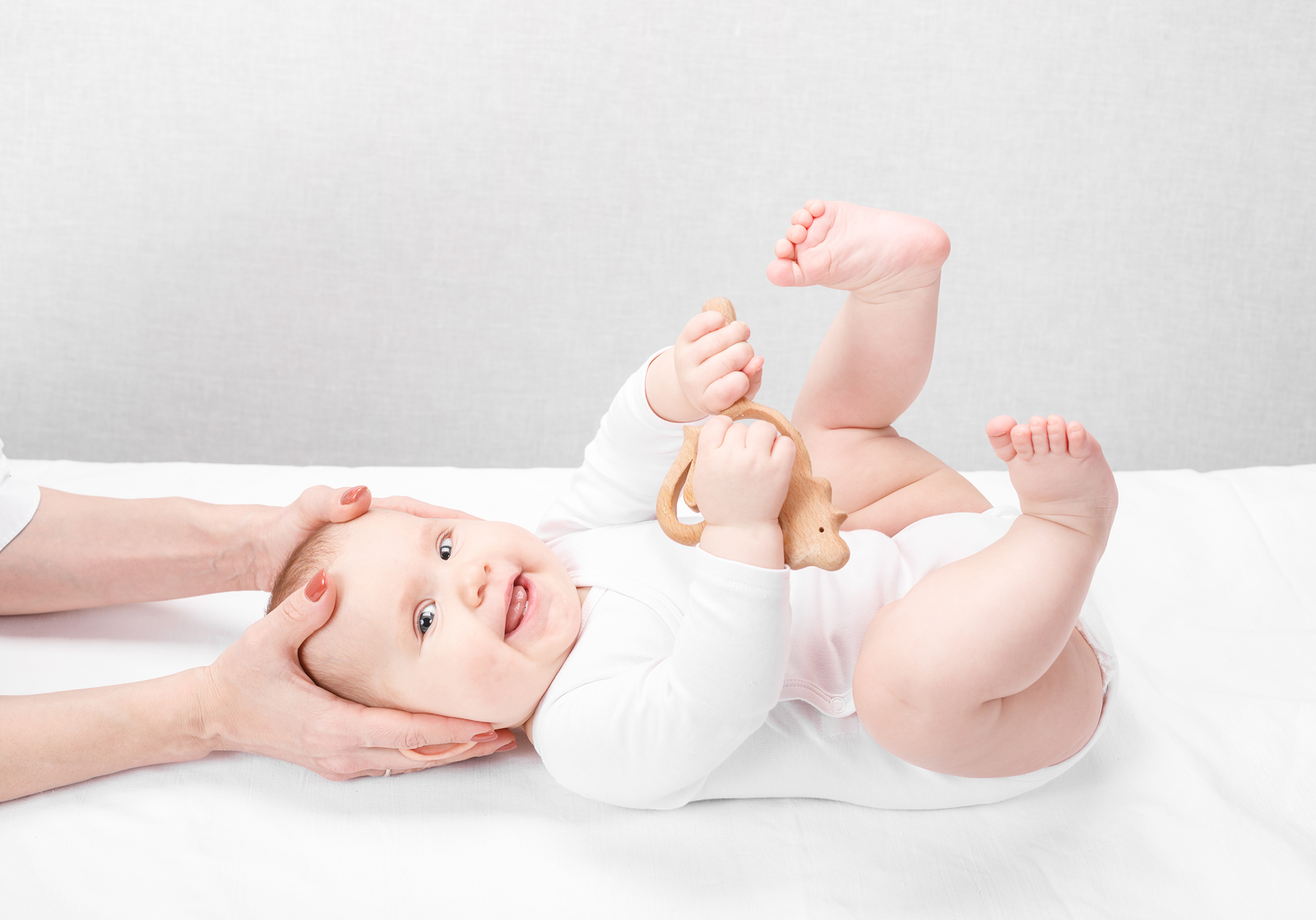 An infant receiving gentle, hands-on care